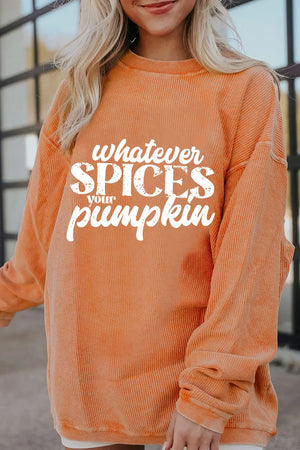 Textured graphic crewneck sweatshirt in sherbet orange with "whatever SPICES your pumpkin" text.