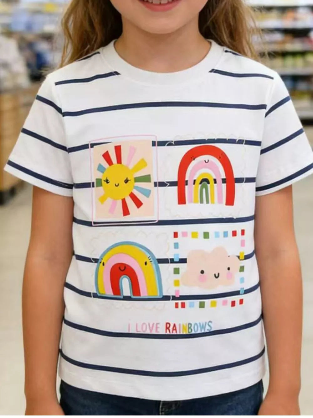 Baby t-shirt with navy stripes, featuring rainbow and sun graphics and "I Love Rainbows" text.
