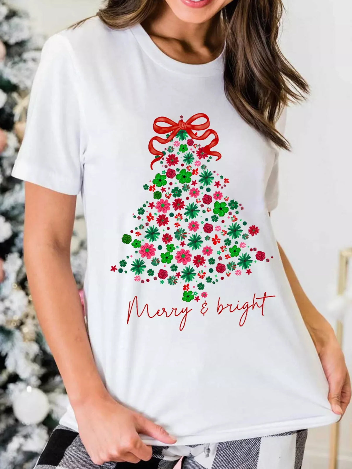 White t-shirt with floral Christmas tree graphic and Merry & Bright text