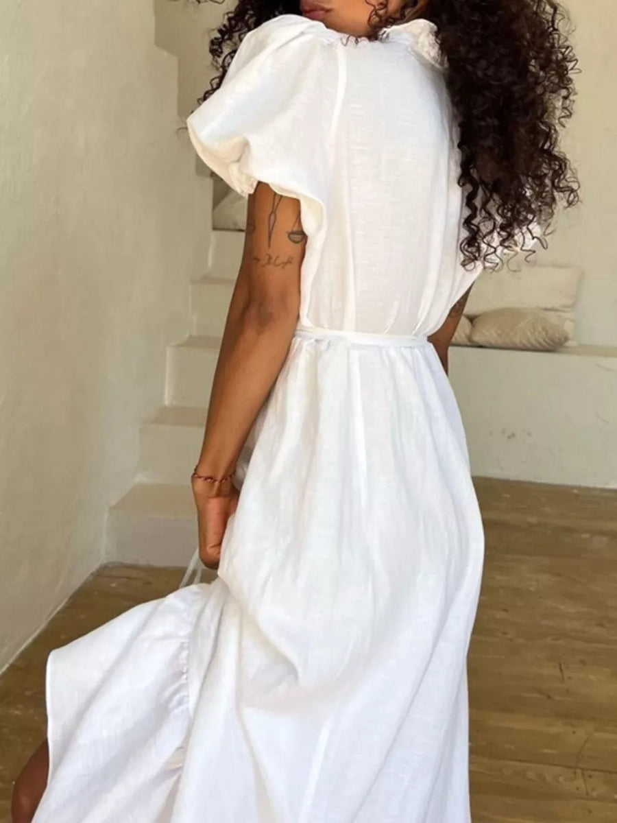 White linen midi dress with puff sleeves and a ruffled collar