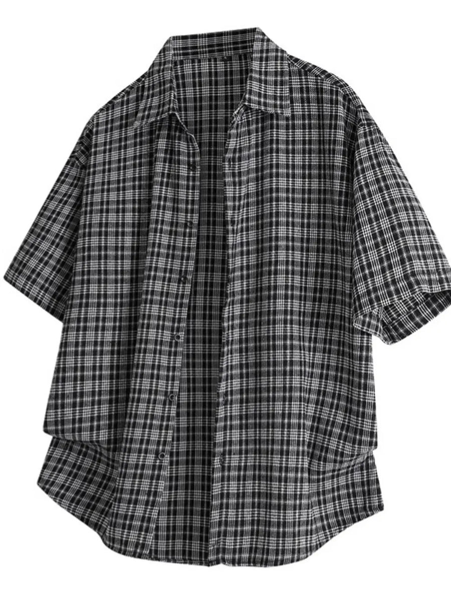 Black oversized plaid button-front shirt with short sleeves.