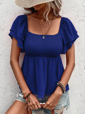 Blue textured smocked blouse with square neckline and ruffled short sleeves