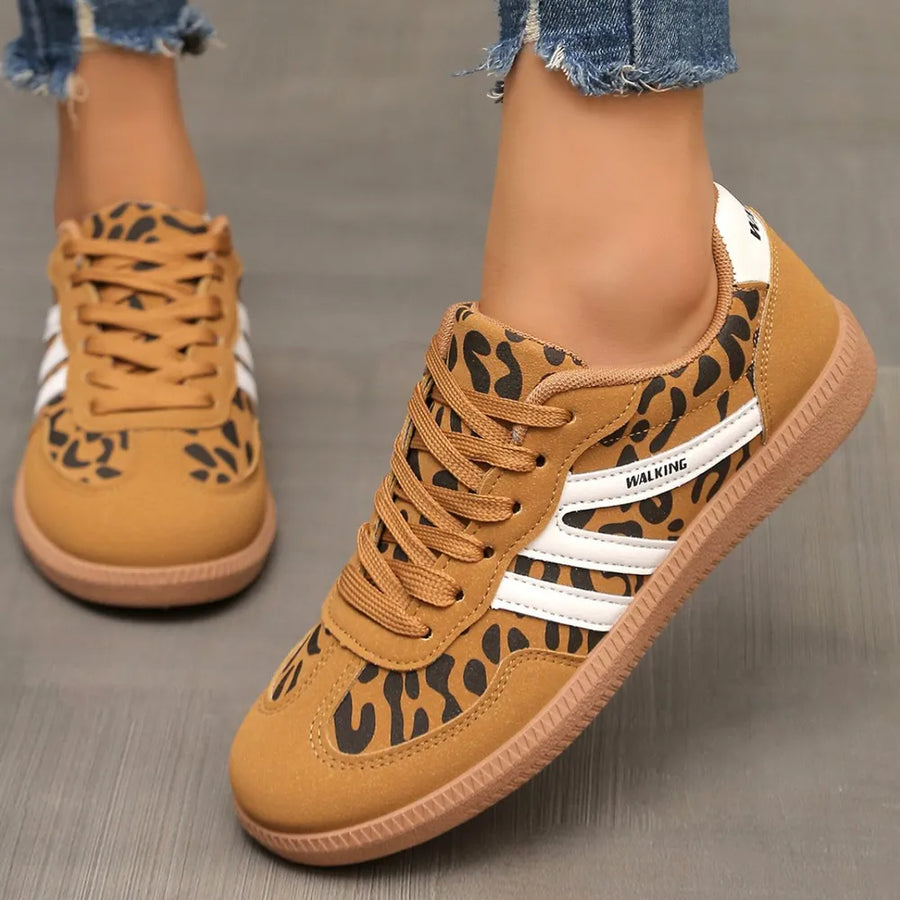 Retro stripe walking sneakers in leopard print with white side stripes and brown soles.