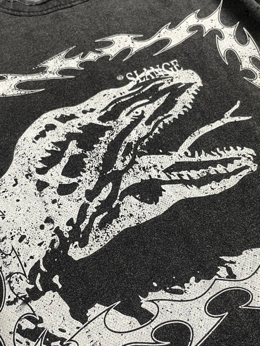 Black distressed graphic tee with a white dinosaur motif and tribal flames.