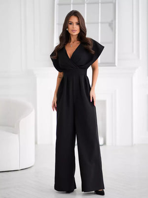 Black wide-leg romper with surplice V-neckline and flutter sleeves.