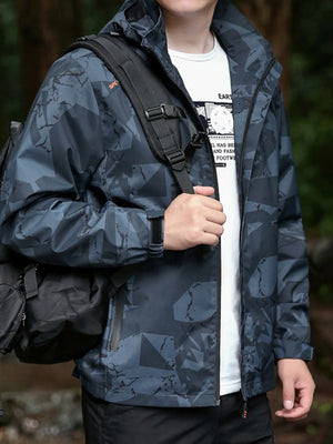 Plus-size dark gray windbreaker jacket with abstract pattern, zip front, and velcro cuffs.