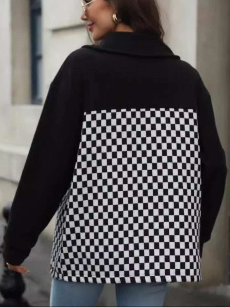 Black button-up jacket with checkerboard panel detail