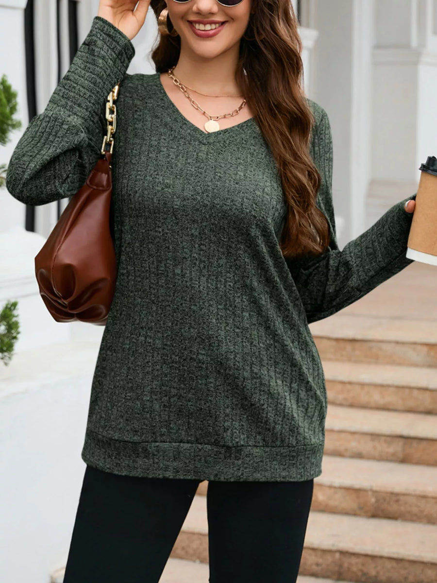 Green textured V-neck long-sleeve knit sweater with ribbed detail.