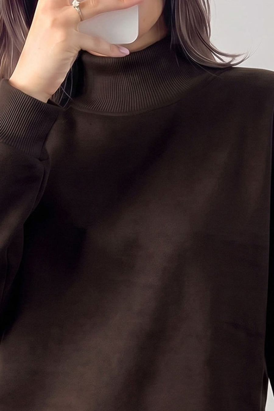 65% polyester, 35% cotton Care instructions: Machine wash cold sweatshirt in dark brown with relaxed silhouette