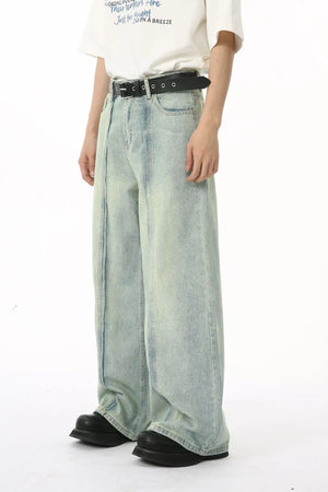 Light wash denim palazzo trousers with vertical seams and a wide leg.