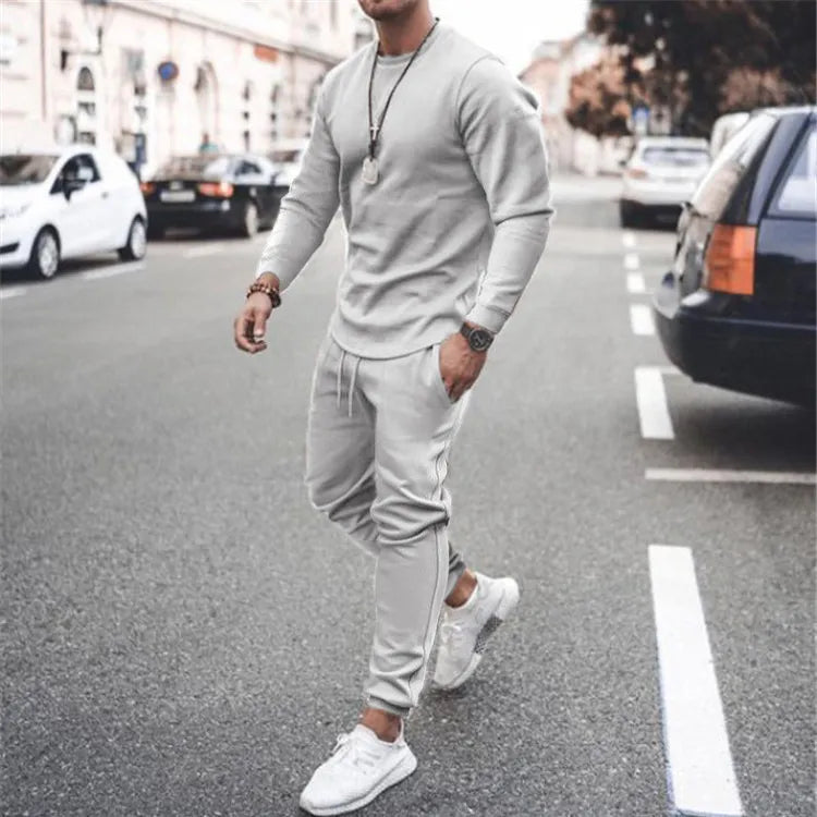 Men's gray textured loungewear set with crewneck sweatshirt and drawstring joggers.