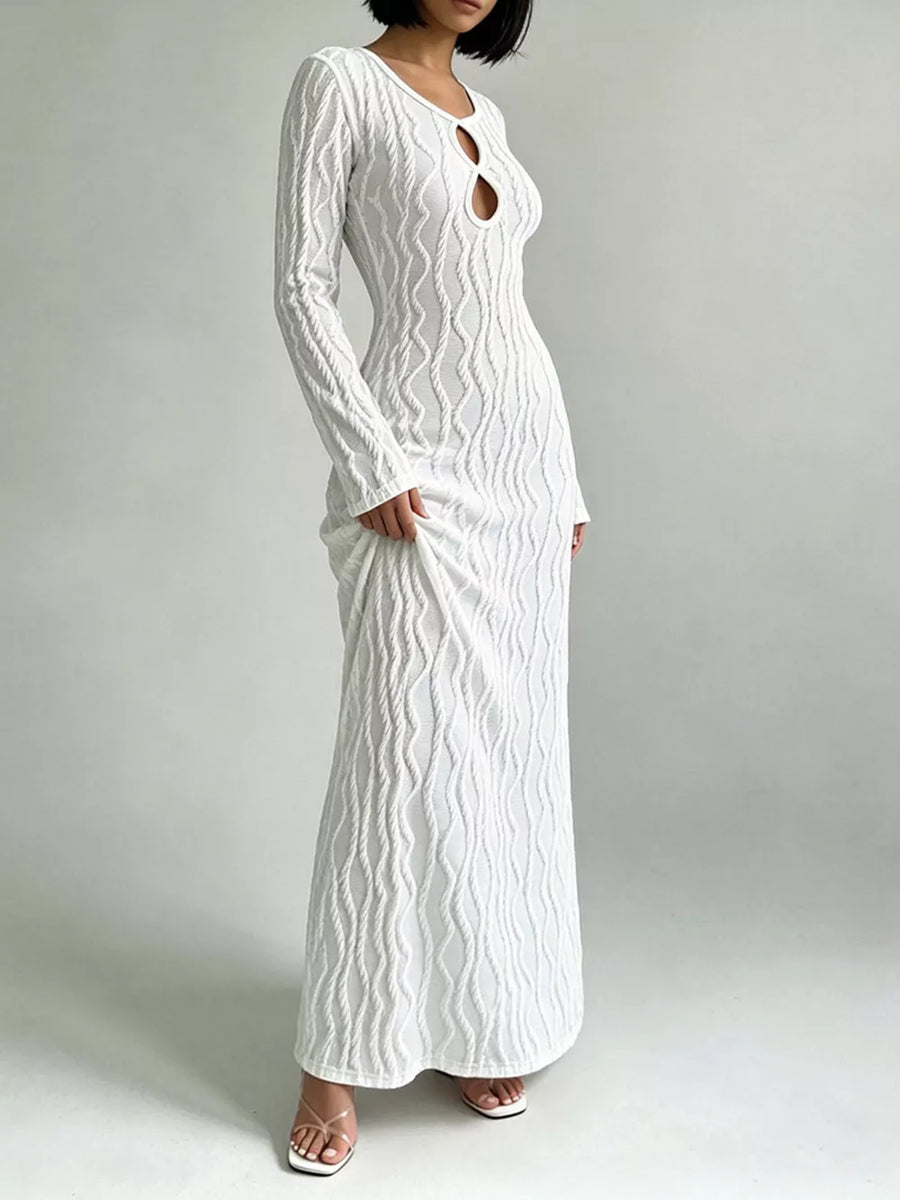 White textured long sleeve maxi dress with cutout neckline and bodycon fit.