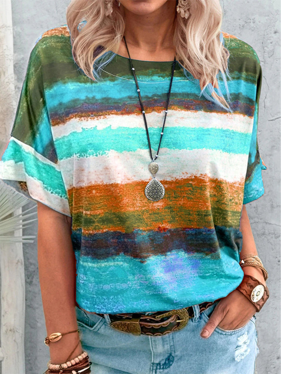 Casual t-shirt with brushstroke stripes in green, orange, blue, and white.