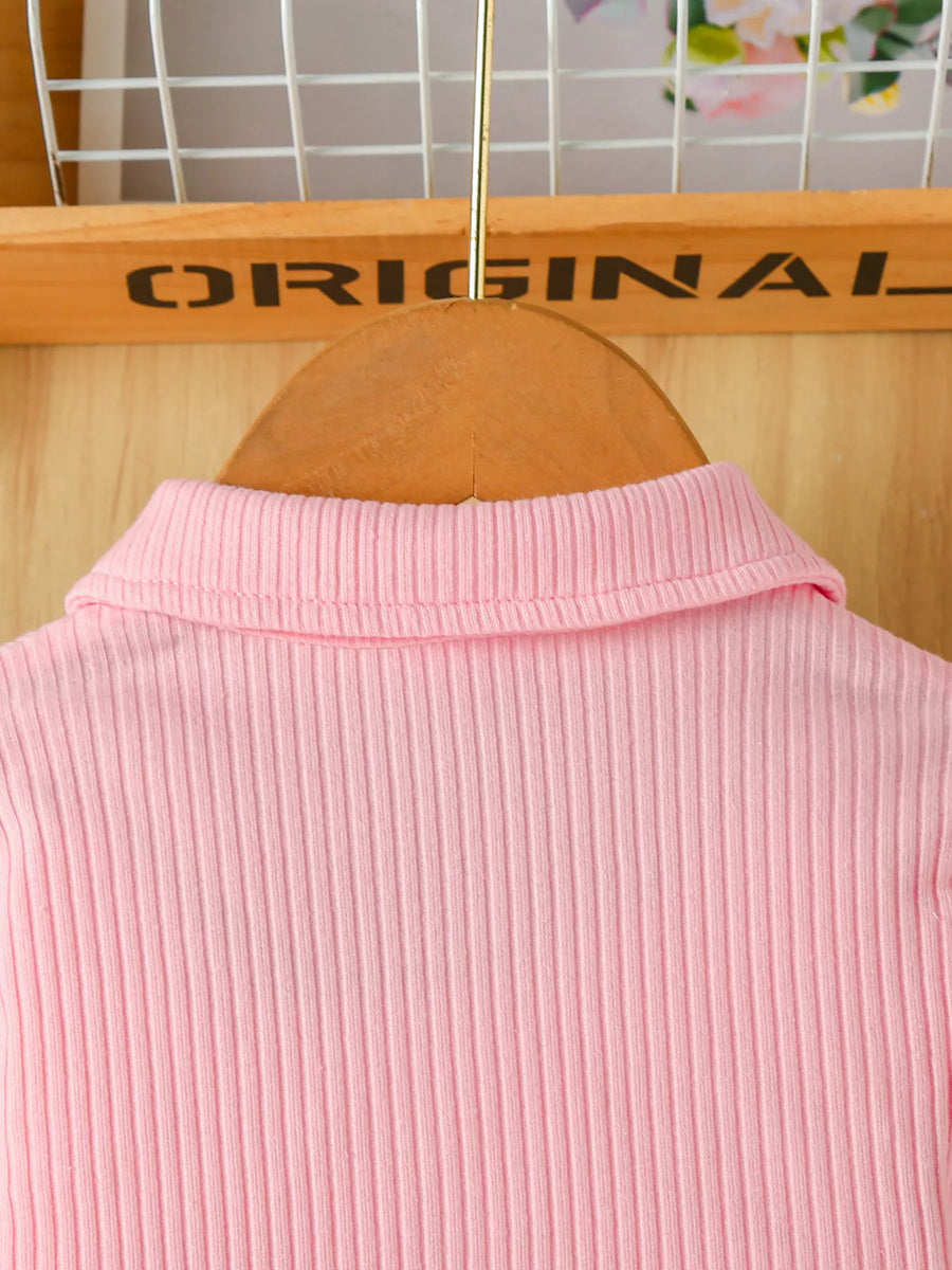 Blush pink ribbed polo shirt detail with collar
