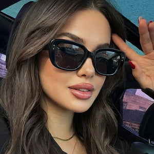 sunglasses in black featuring UV400 protection and rectangular fit
