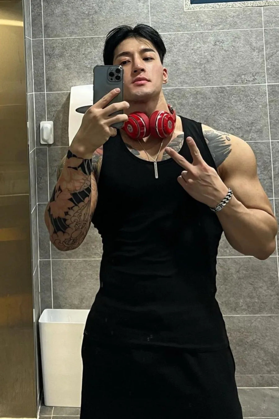 Black ribbed cotton muscle tank top with a crew neck.