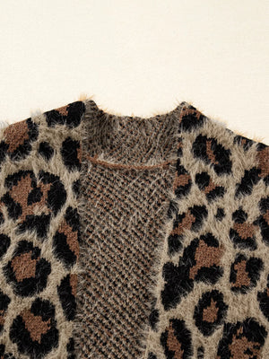 Leopard print fuzzy knit cardigan with a textured yoke and raw edge trim.