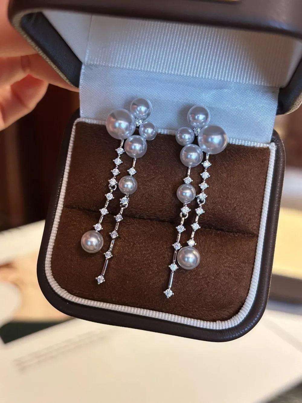 earrings in light gray featuring pearl cluster and dangle fit