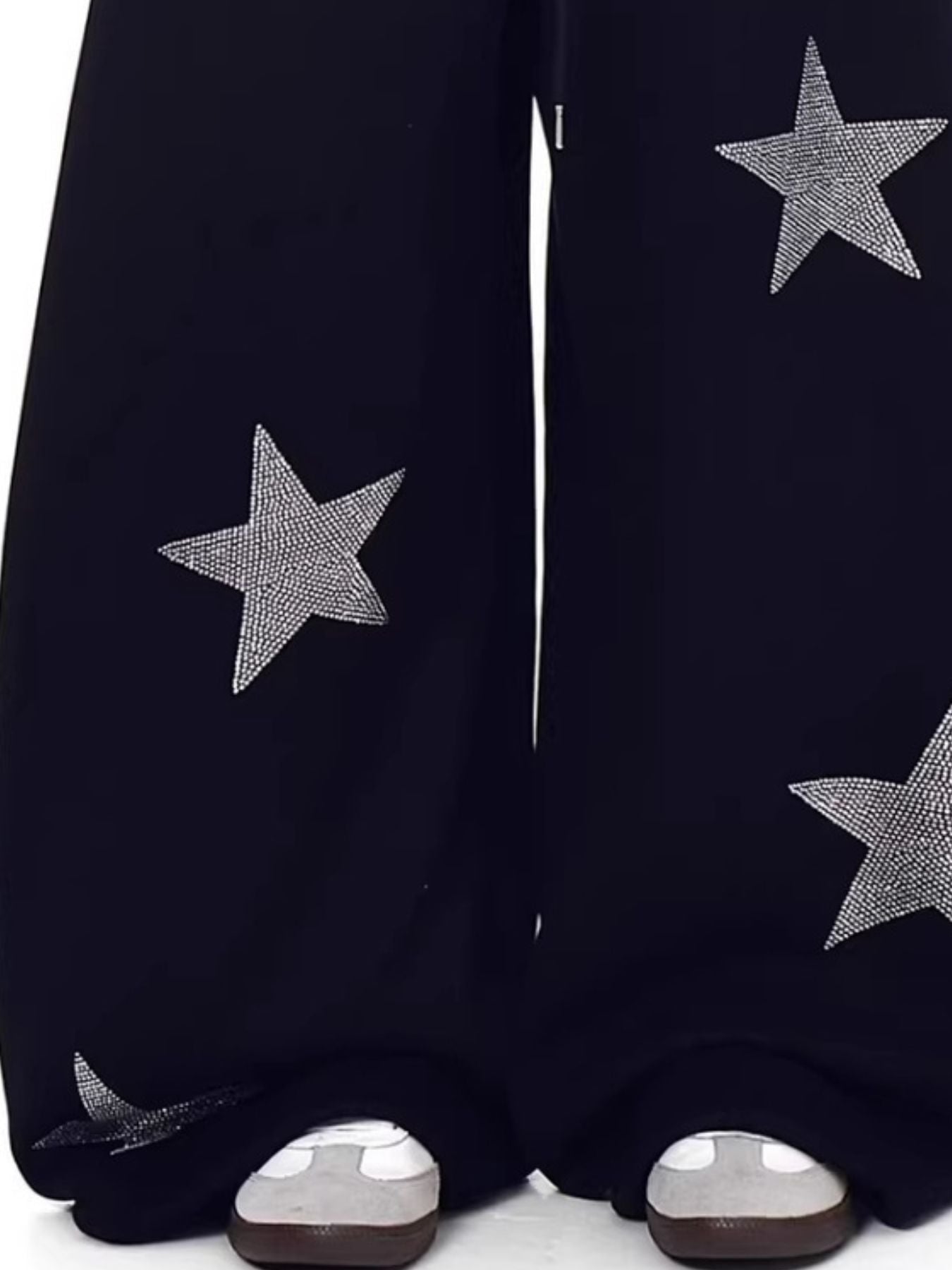 Black wide leg sweatpants with allover rhinestone star embellishments.