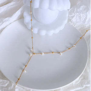 Gold lariat necklace with pearls and gold beads, 18K gold-plated.