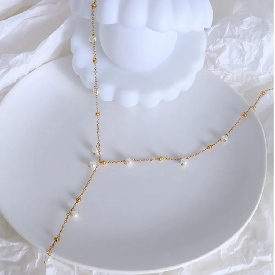 Gold lariat necklace with pearls and gold beads, 18K gold-plated.
