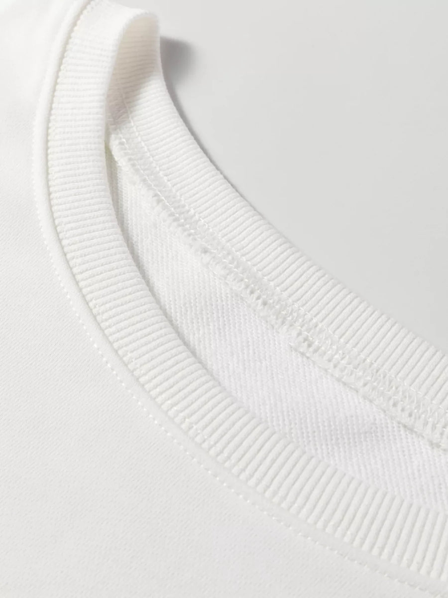 White crewneck loungewear top with ribbed neckline and visible stitching detail.