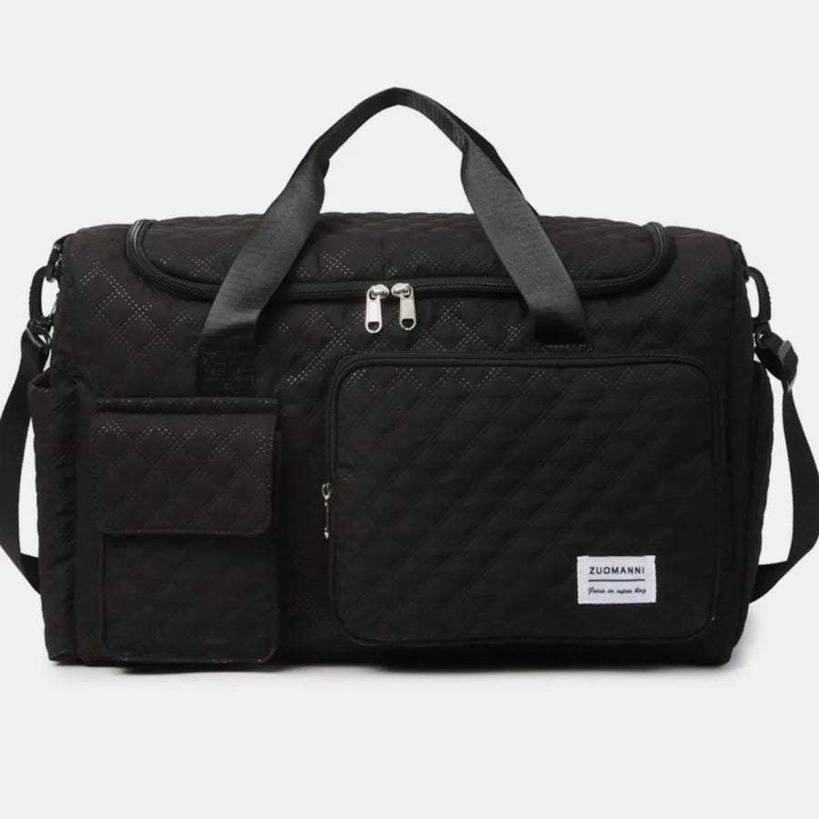 Black quilted duffel bag with olive accents, dual handles, and multiple pockets.