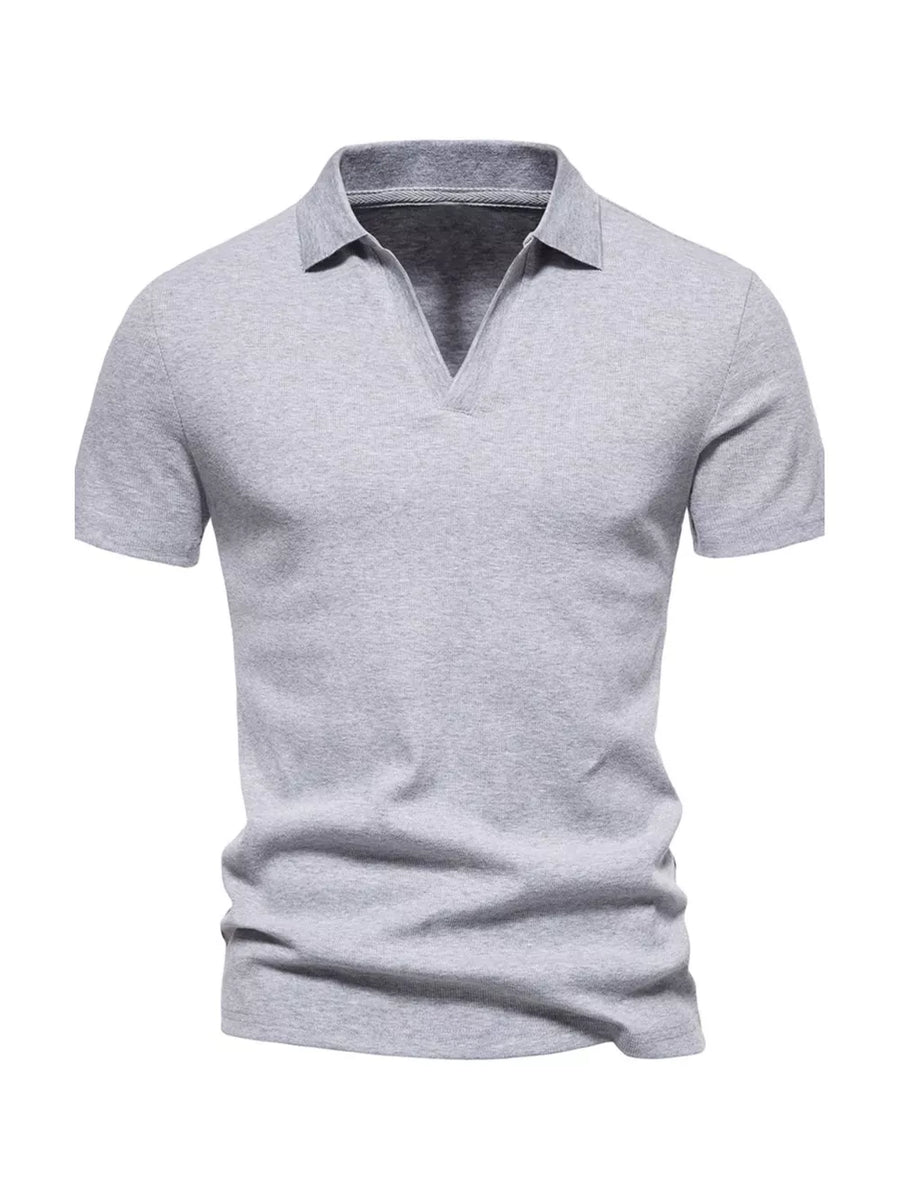 Men's light gray cotton blend polo shirt with notched collar and short sleeves.