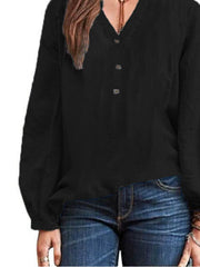 Black long-sleeve blouse with notched neckline and button detail.