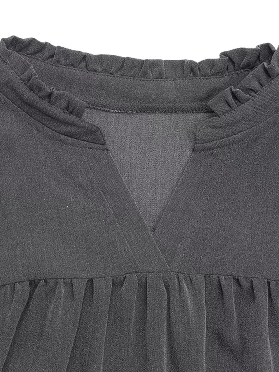 Dark gray cotton blend dress with ruffled neckline and V-neck detail.