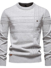 Gray crewneck knit sweater with textured horizontal and vertical panels and a single button detail.