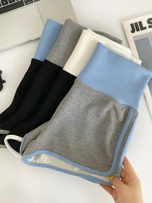 Contrast trim high-rise athletic shorts in light blue and gray with a comfortable, casual fit.