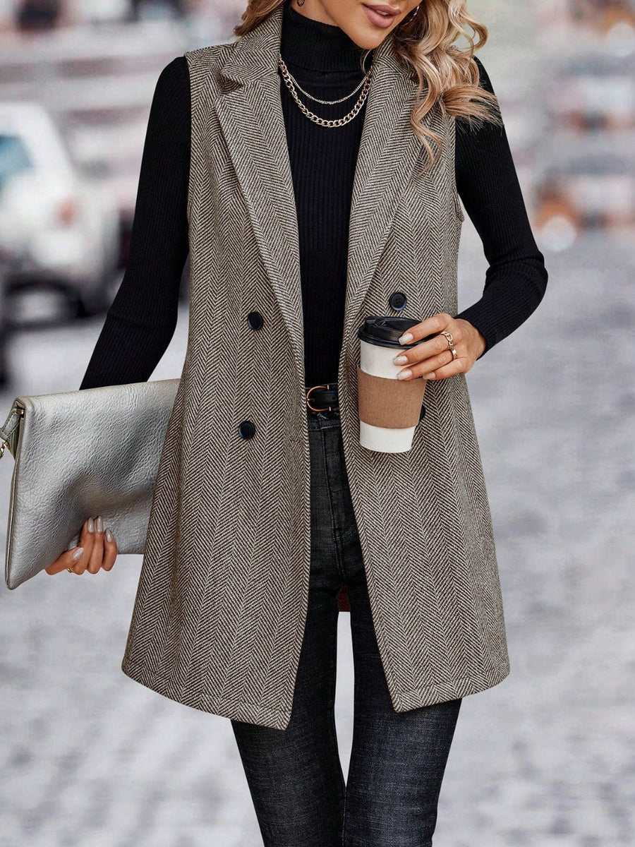 Herringbone tailored vest in taupe with double-breasted closure and collared neckline.