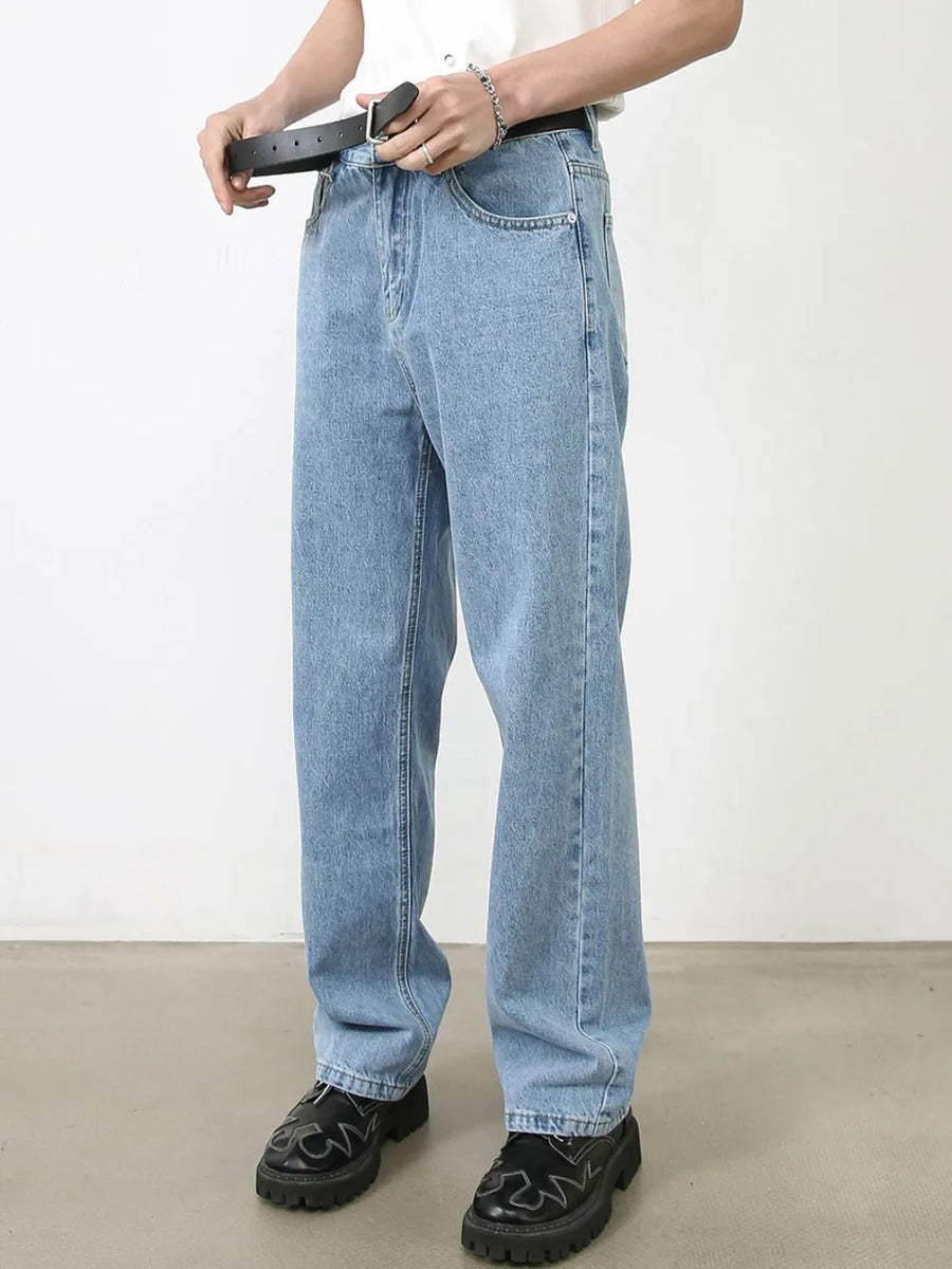 Relaxed-fit light blue denim jeans with subtle seam detail and a straight leg cut.