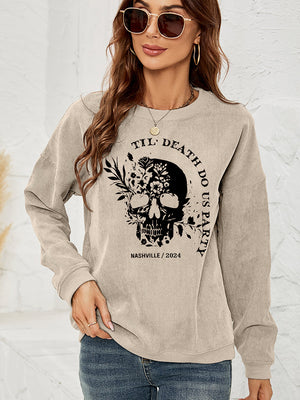 Sand corduroy sweatshirt with a black floral skull graphic and text.