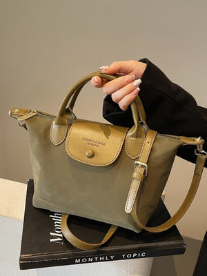 Green nylon crossbody bag with flap and adjustable strap