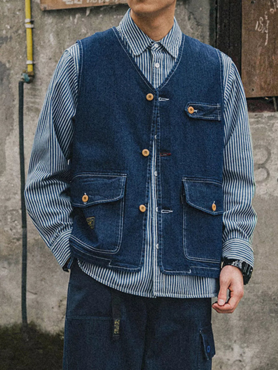 Navy denim vest with V-neck, button-up front, and four pockets.