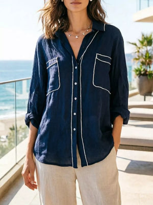 Navy linen shirt with white piping, button-down, and two chest pockets.