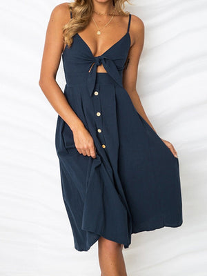 Dark Blue midi sundress with cami straps, bow front, and button detail.