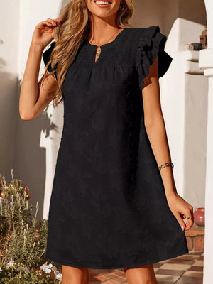Black floral embossed mini dress with smocked bodice and ruffled sleeves.