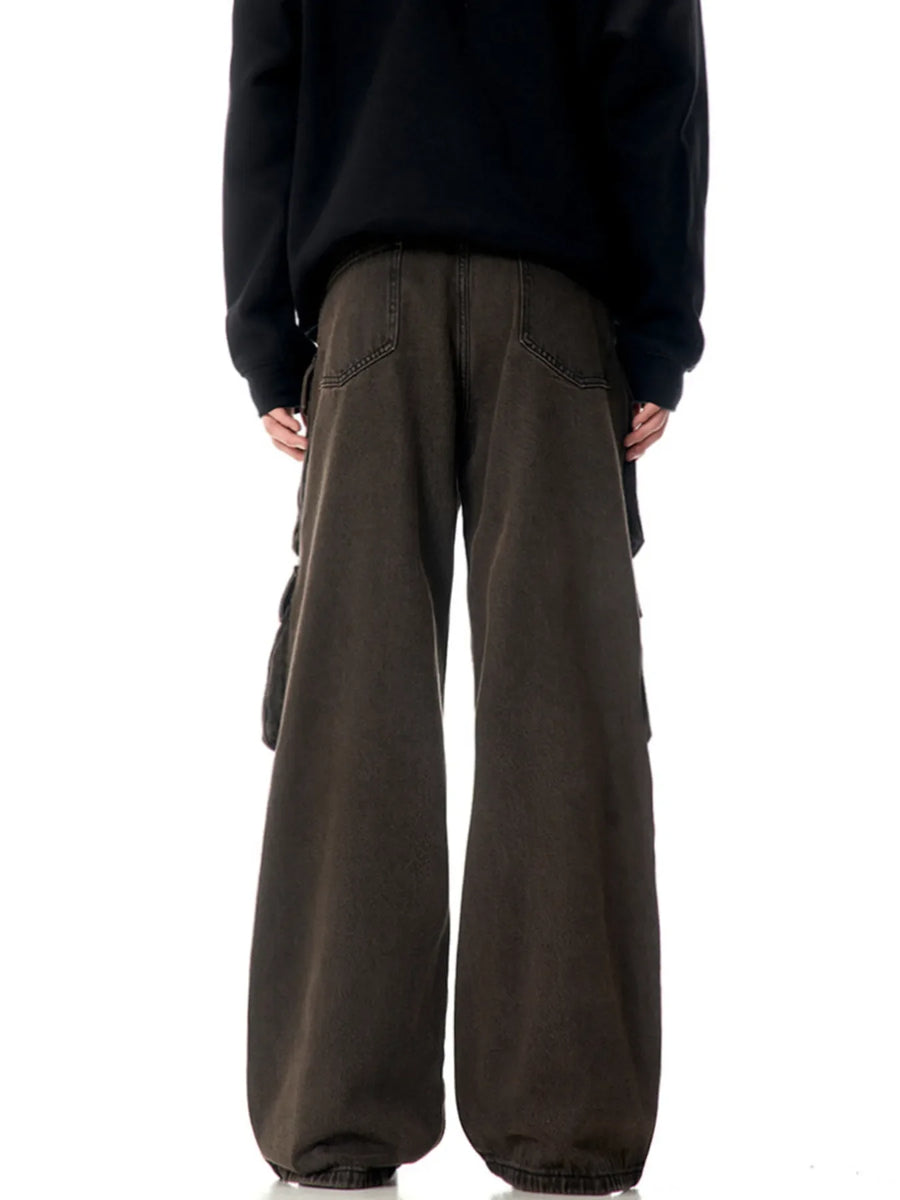Men's relaxed fit cargo pants in washed brown with multiple pockets and a wide leg.