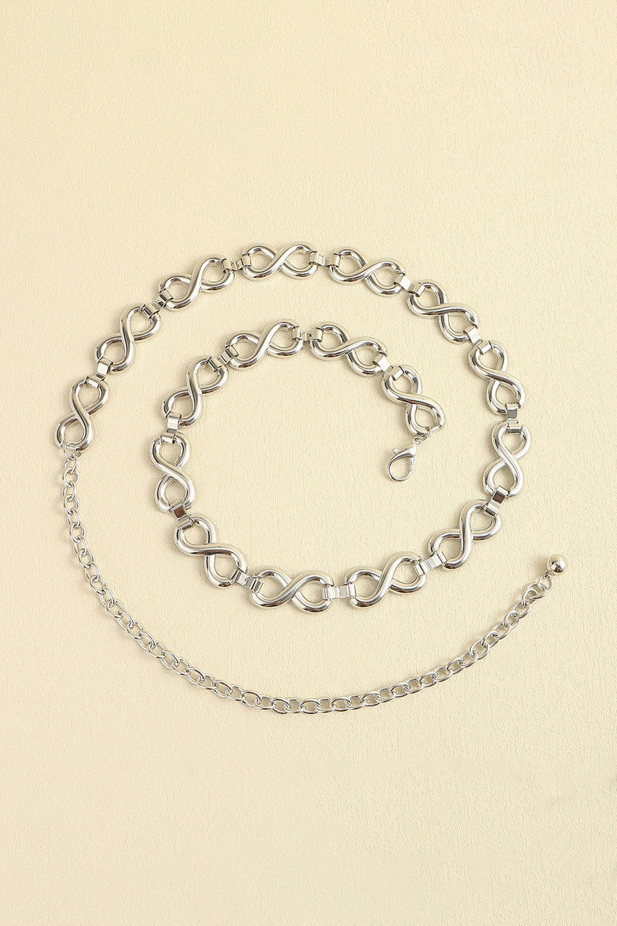 Silver infinity chain waist belt with lobster clasp and extender chain.