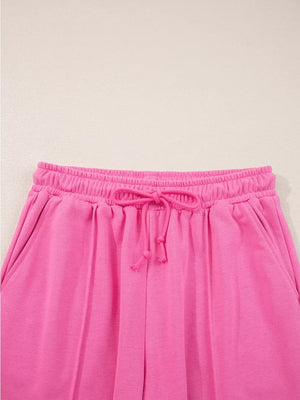 Hot pink casual pants with elastic waistband and drawstring detail