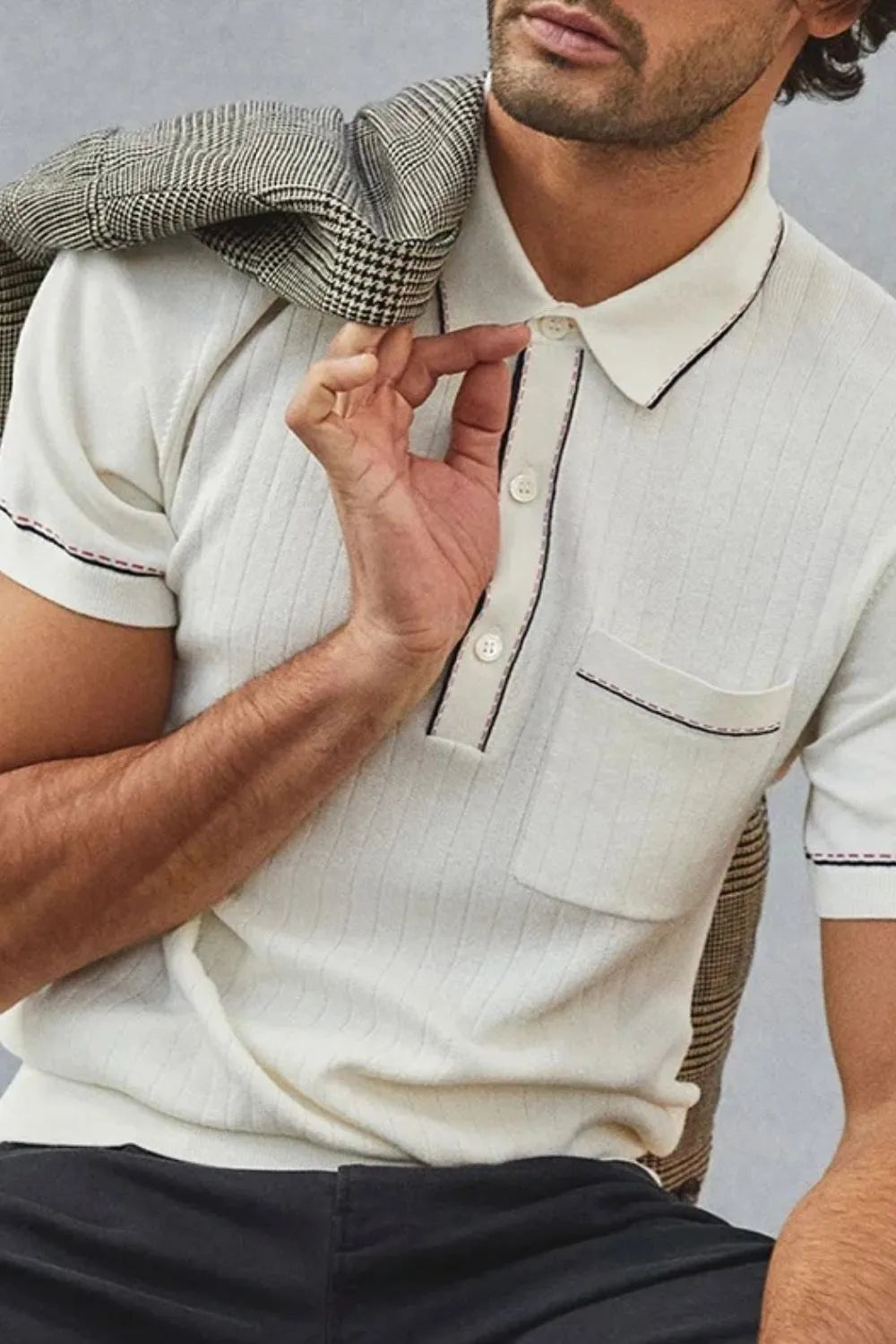 Ivory ribbed knit polo shirt with contrast piping and pocket detail