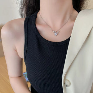 Sterling silver antler necklace with moissanite charm.