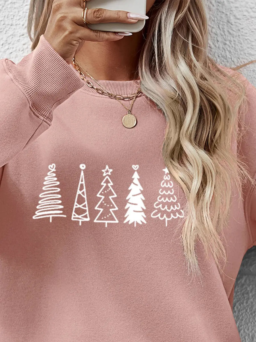 Blush pink crewneck sweatshirt with a white festive tree line graphic and ribbed cuffs.