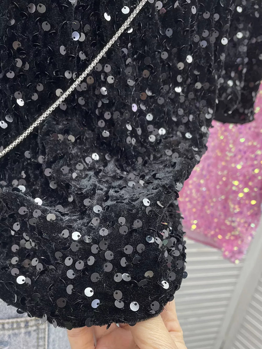 Black iridescent sequin embellished t-shirt with crew neck and short sleeves.