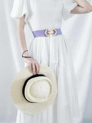 Lavender elasticated waist belt with geometric gold buckle detail.