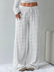 Light gray and white striped crop top and wide-leg pants with drawstring waist.