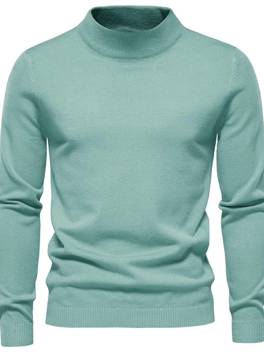 Light blue ribbed mock neck sweater with long sleeves and a classic fit.